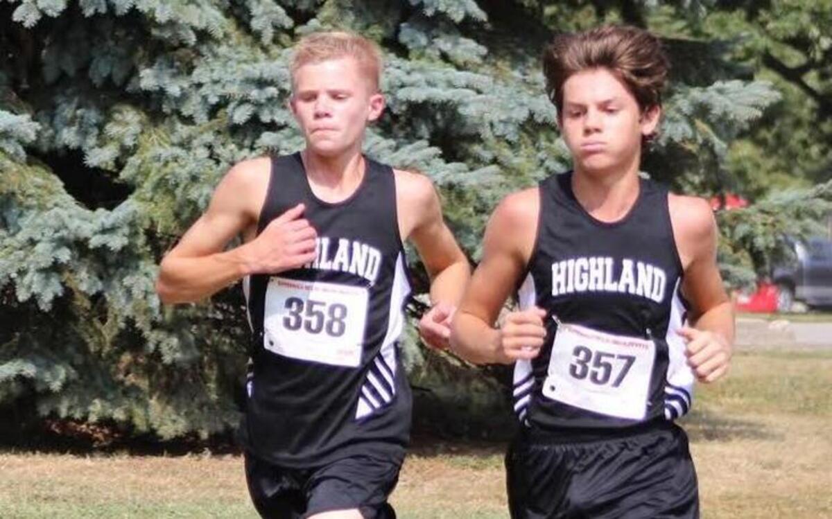 Highland freshman Easton Rosen, left, and sophomore Brylee Portell run side by side en route to placing 11th and ninth, respectively, out of more than 100 runners Saturday at the Springfield Invitational.