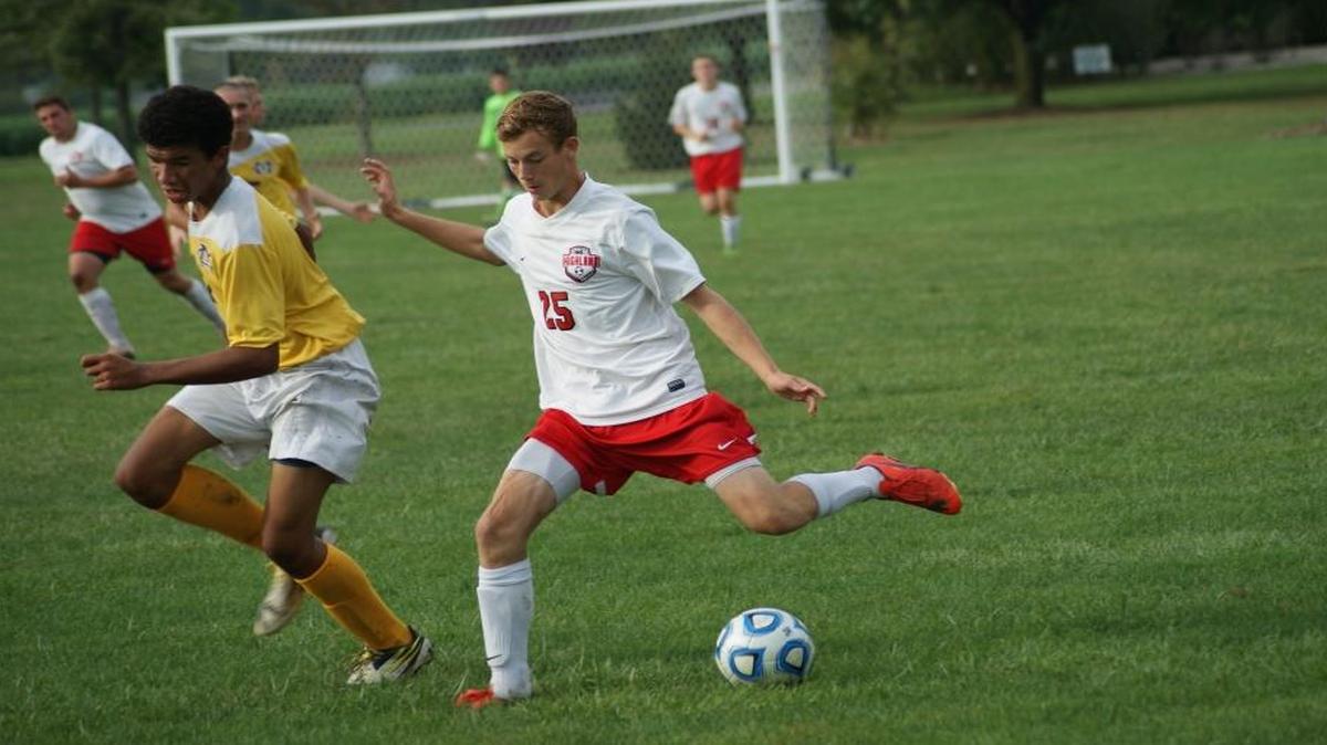 
Highland sophomore Andrew Roach gets ready to pass the ball while being defended by Civic Memorial sophomore Jayden Heeren during the Bulldogs’ 6-0 win over the Eagles on Tuesday of last week.
