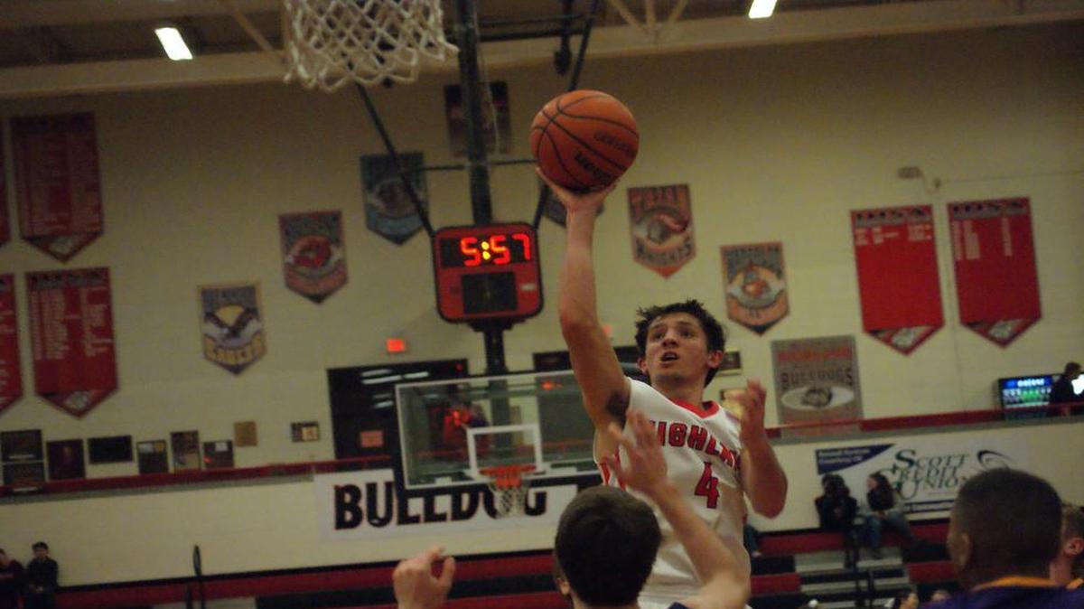 Highland senior Brode Portell scores on a short jump shot in the lane during the third quarter of the Bulldogs’ 52-45 win over visiting Civic Memorial that gave HHS a perfect 10-0 sweep of the Mississippi Valley Conference Tuesday on Senior Night.