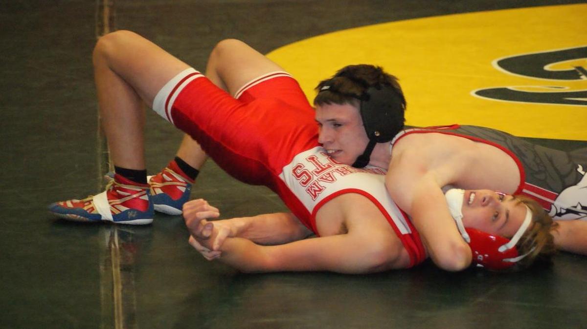 Highland junior Jacob Mitchell gets set to pin Effingham’s Brody Beck at the 3:11 mark of their 126-pound match Tuesdsay night at HHS.
