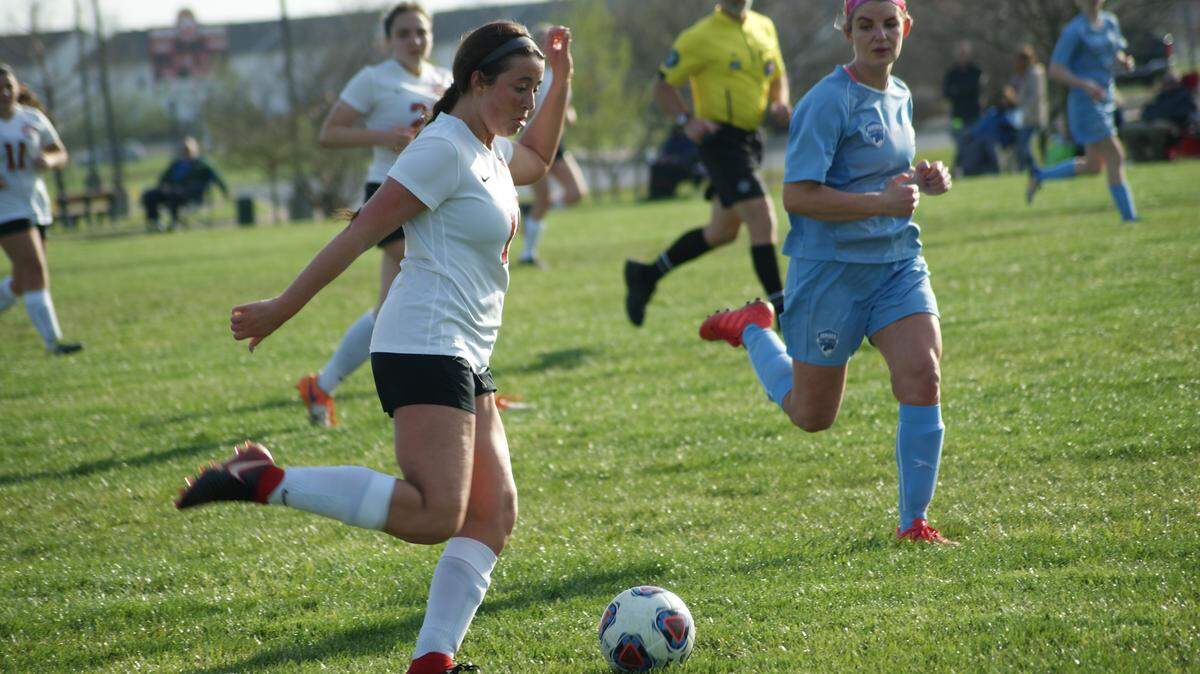 Highland senior Kallie Painter dribbles the ball up the field into Jerseyville's end of the field during the Lady Bulldogs' 1-0 victory over the Panthers Tueday, April 17 at Glik Park. Painter scored a goal in Highland's 3-3 tie with Mater Dei on Thursday.
