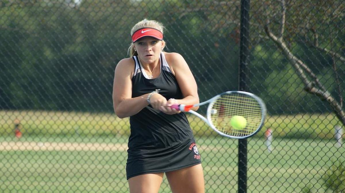 Highland senior Kirsten Plocher, shown hitting a backhand, won all three of her singles matches last week to help the Lady Bulldogs bounce three opponents and boost their head-to-head record to 14-3.