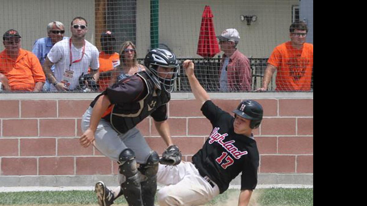 
Highland junior Sam Greene slides safely into home plate for the walk-off winning run in the bottom of the ninth inning on senior Tyler Kimmle’s double to beat Mount Vernon 6-5 and win the championship of the Class 3A Salem Sectional on Saturday.
