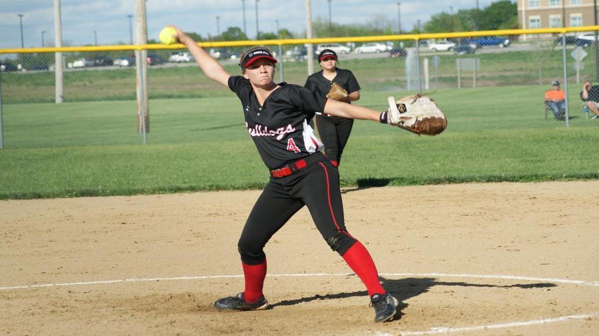 Highland sophomore Kirsten Plocher, shown with junior second baseman behind her, fired her second straight playoff shutout after baffling Herrin to four hits and two walks while striking out seven in the Bulldogs’ 4-0 victory in a semifinal of the Class 3A Herrin Sectional Thursday.