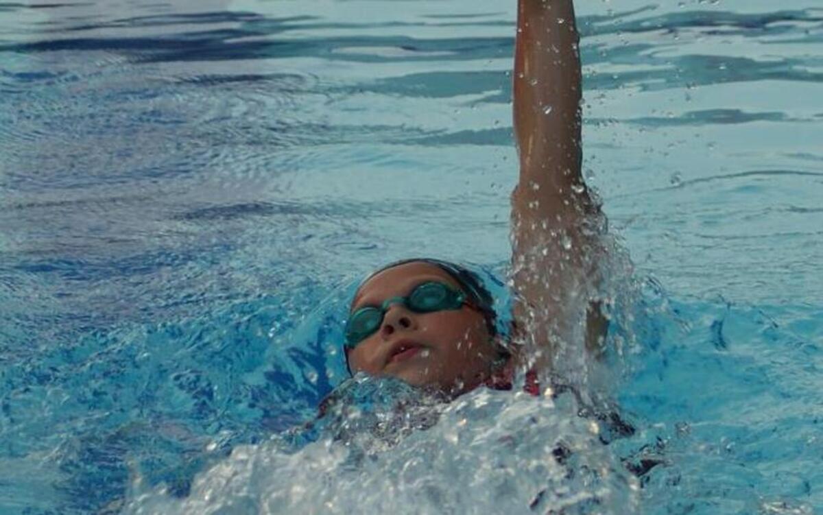 
Highland Splash summer Baylie Wells, 9, is shown recenly swimming the backstroke, won two events and finished second in another to help the Splash easily outpoint the host Kings Point Stingrays. Welll won the girls 9-10 25-meter breaststroke and 25-meter butterfly while she finished second in the 25-meter backstroke. 

