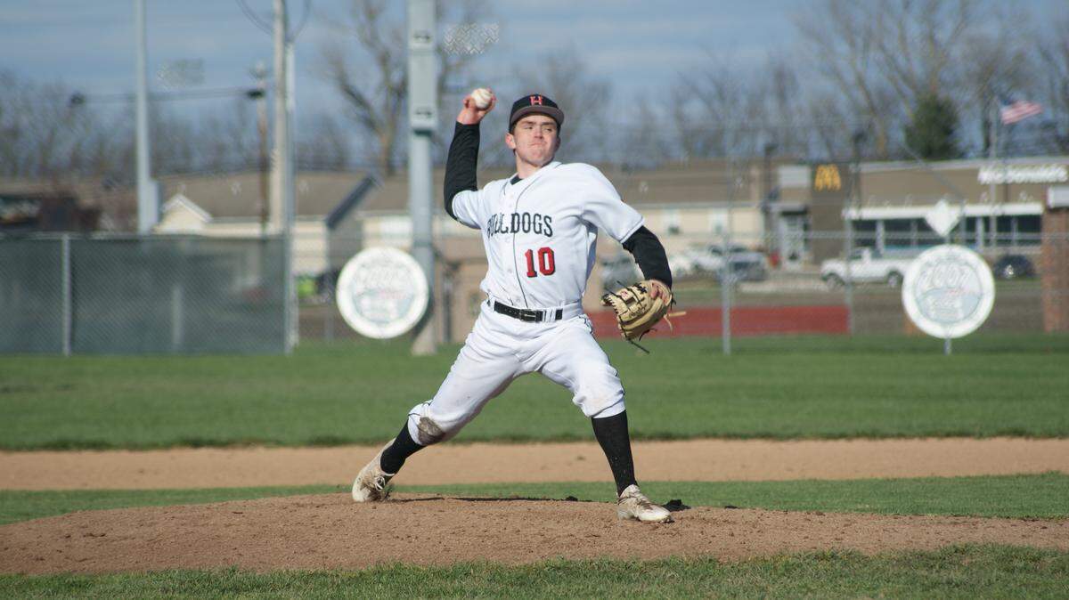 Highland junior Griffin Frahm delivers a pitch in the third inning of the Bulldogs' 12-7 home victory over the Wesclin Warriors on Wednesday, April 4 at Glik Park. Frahm was the winning pitcher in a relief role.