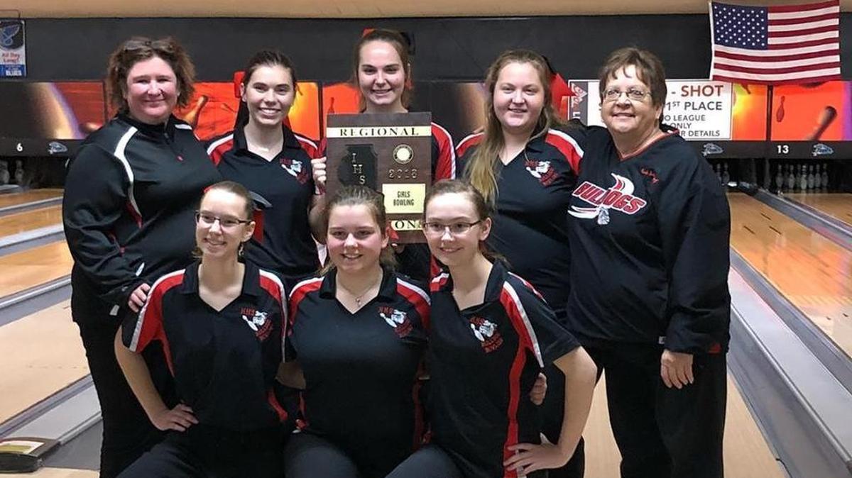 The Highland High School girls bowling team shows off the plaque they earned after winning the IHSA Alton Girls Bowling Regional on Saturday at Bowl Haven Lanes in Alton. The Lady Bulldogs consist of, front row from left to right(kneeling), junior Delaney Grimes, freshman Molly Marshall, sophomore Kayla Rutz; back row, head coach Laura Wander-Vrell, senior Kali Rutz, senior Emma Schuster, senior Haley Basler and assistant coach Pam Schrumpf.