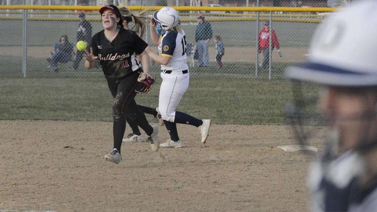 After securing the final out, Highland’s Lily Garbett celebrates the Bulldogs’ 2-0 victory over O’Fallon Panthers on Thursday.