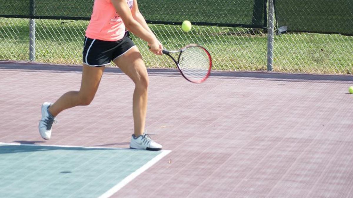 
Highland sophomore Kirsten Plocher hits a backhand.
