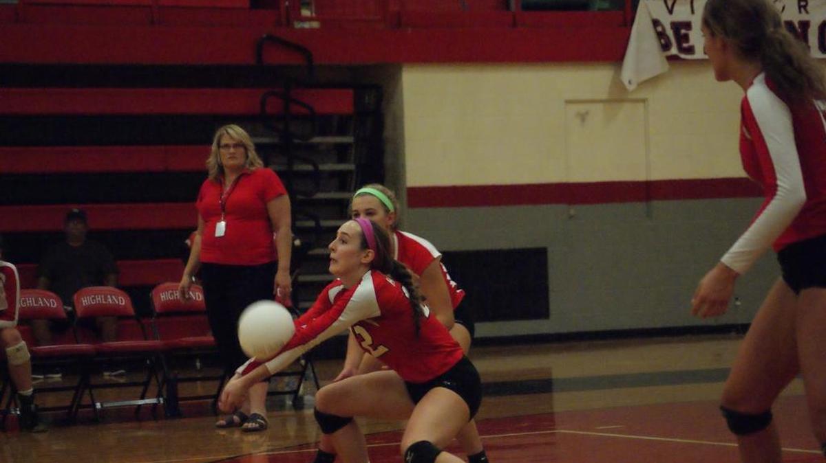 
Highland junior Madison Wellen recently bumps the ball up as, from left, coach Tina Beyer and junior teammates Sarah Beth Wiegman and Alex LaPorta look on.

