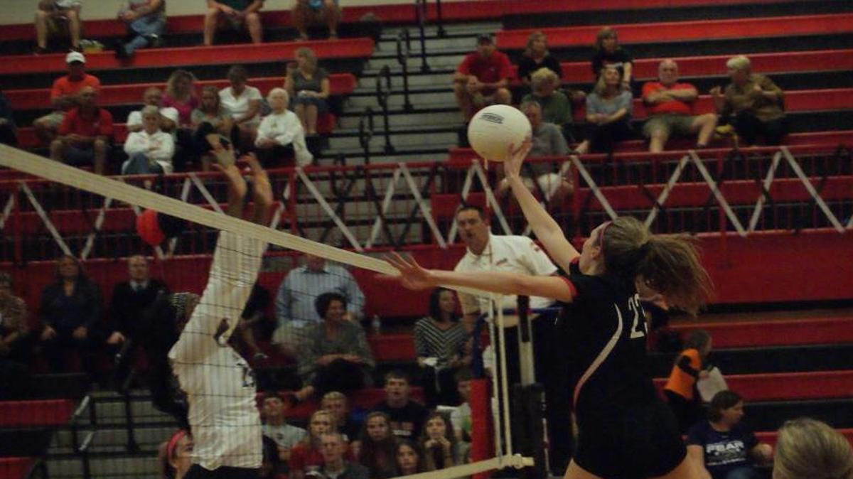 Highland senior Hayley McSparin goes up to make a play on the ball during Mascoutah last Thursday night during Senior Night at HHS. On Tuesday night, McSparin swatted down a match-high 10 kills to power the Lady Bulldogs past Waterloo, 25-11, 26-24, and advance to Thursday’s championship match of the Class 3A Mascoutah Regional, where HHS will face the host Indians at 6 p.m.
