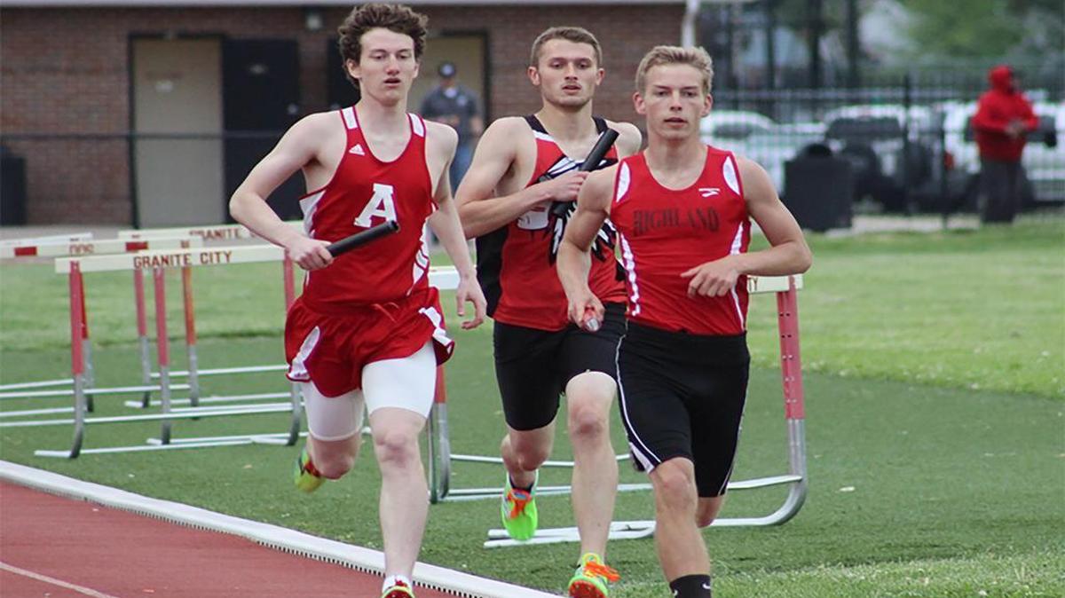 Highland junior Bryce Sexton, leads a small pack while running a leg of the 4 x 1,600-meter relay team that finished third at the Granite City Warrior Relays. Sexton ran the relay team’s best time at 4:53.4.