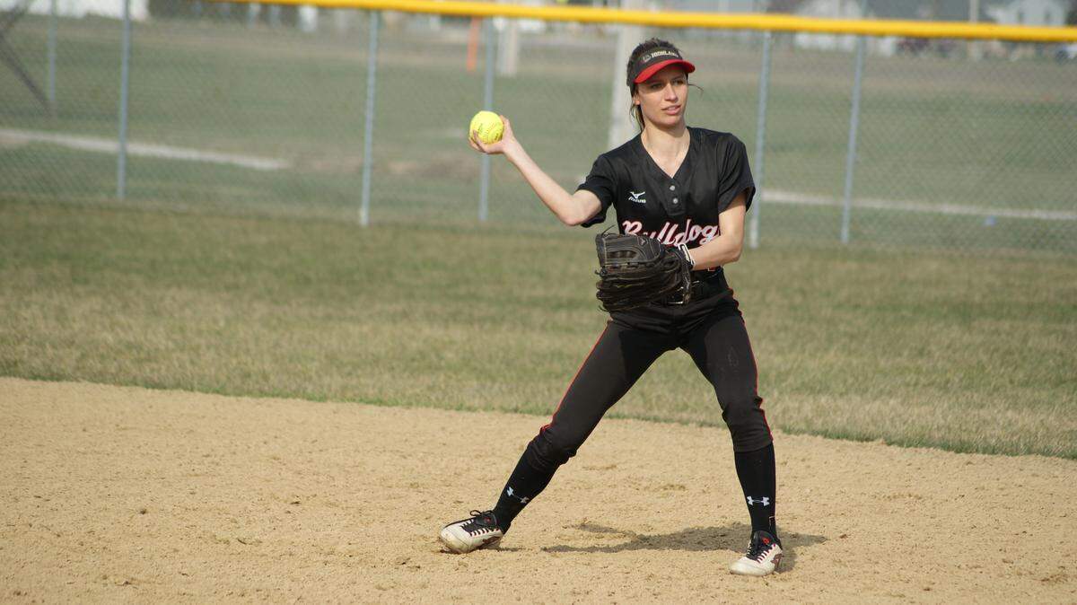 Highland senior second baseman Kourtney Zobrist, shown throwing the ball to first base to record an out, smacked a two-run triple in the top of the fourth inning of the Lady Bulldogs' 11-1 rout of host Granite City on Thursday.