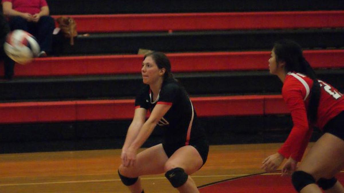 Highland junior outside hitter Jennessa Kimmle goes down for one of her 27 digs while she also shared team-high honors with eight kills to help the Lady Bulldogs outlast visiting Waterloo 21-25, 25-17, 25-19 Tuesday, Oct. 18 and win the outright MVC crown for the first time in six years.