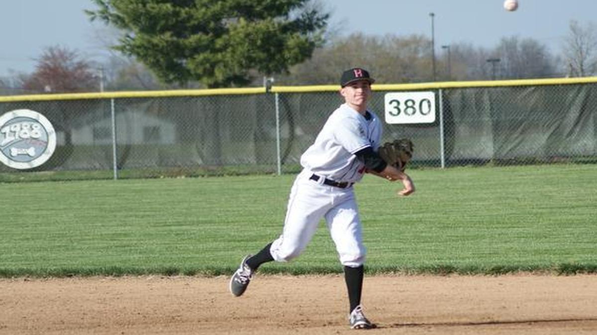 Highland senior second baseman Tyler Pollard throw the ball to first base to compete an out during the Bulldogs’ 9-1 win over the visiting Roxana Shells Friday at Glik Park.