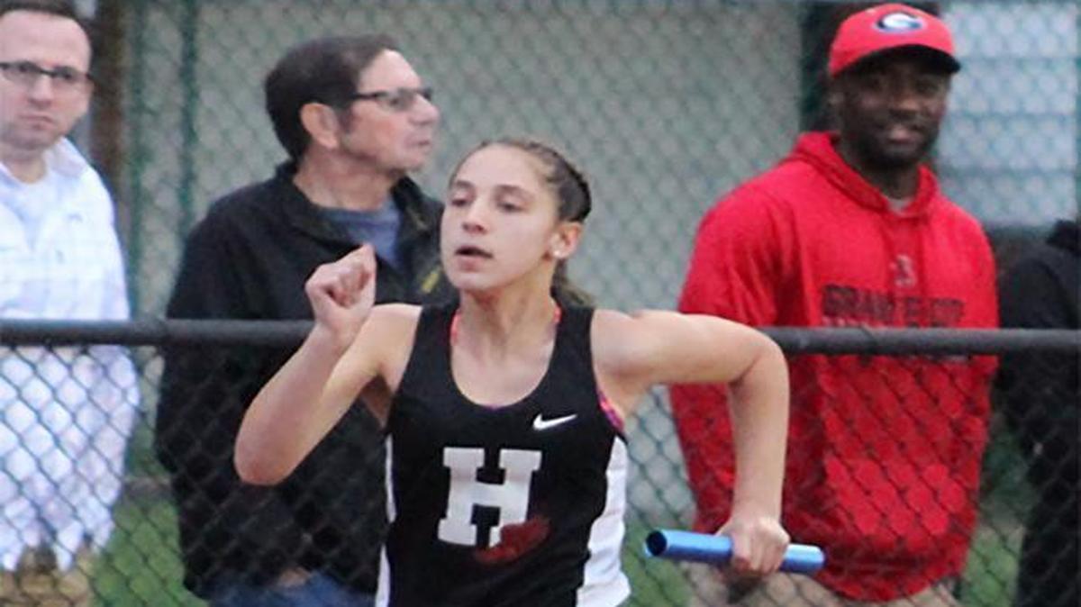 Highland freshman Lily Becker runs a leg of the 4 x 1,600 relay team that captured first place at the inaugural Granite City Warrior Relays Friday at Granite City High School. Becker also ran a leg of the Lady Bulldogs’ winning freshman/sophomore 4 x 400 relay team.