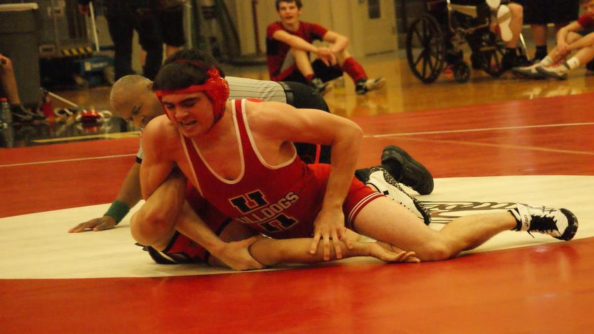 Highland senior Brody Kirsch pins Mascoutah’s Christian Lugo late in their 170-pound match en route to going 5-0 and being crowned a conference champion at the Mississippi Valley Conference Super Duals Saturday at Highland High School.