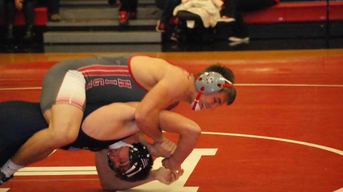 Highland junior Trent Rakers, shown controlling a Pinckneyville opponent earlier this season, dominated four opponents to hammer out the individual title at 160 pounds Saturday at the 46 th annual Mascoutah Invitational Wrestling Tournament.