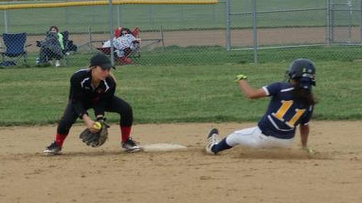 Highland sophomore shortstop Kourtney Zobrist fields the throw at second base while O’Fallon senior Cassie Brown slides in safely with a stolen base during the third inning of the Panthers’ 3-1 victory at HHS on Wednesday.