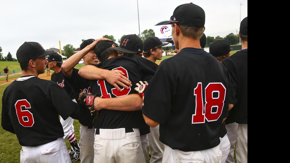 
The Highland Bulldogs celebrate Friday, June 12, 2015, after beating the Morgan Park Mustangs 13-0 during at Silver Cross Field in Joliet, Ill.
