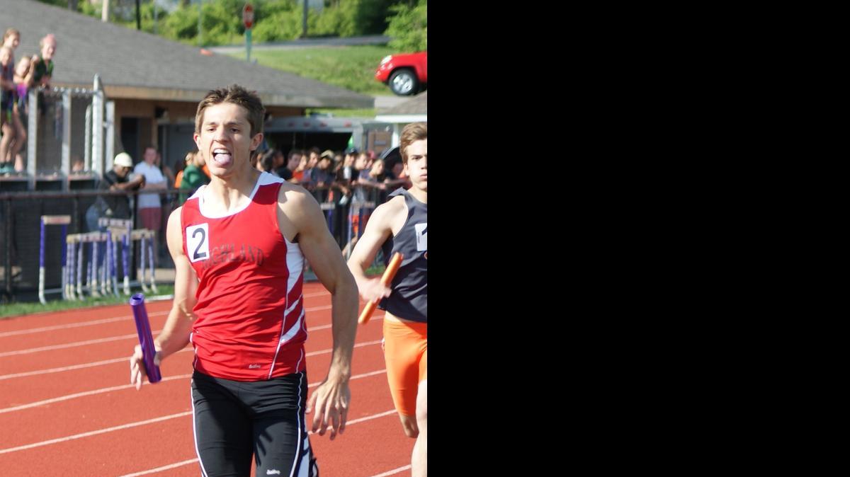 
After battling side-by-side for about a lap and a half, Highland 4 x 800 relay team anchor Brode Portell, a junior, leads Edwardsville’s anchor to the finish line to win the event for the Bulldogs in a triumphant team time of 8:1829. The first three legs of the relay were seniors Trevor White and Grant Riggs, and sophomore Bryce Sexton.
