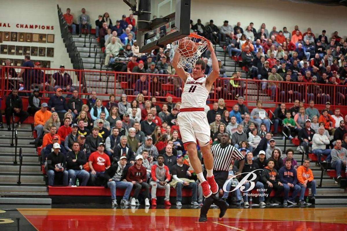 Highland junior forward Sam LaPorta throws down a two-handed dunk to finish the first half of the Bulldogs’ 57-52 victory over the Columbia Eagles last season at the Highland Optimist Basketball Shootout.