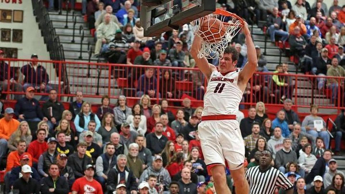 Highland junior forward Sam LaPorta throws down a two-handed dunk to finish the first half of the Bulldogs’ 57-52 victory over the Columbia Eagles last season at the Highland Optimist Basketball Shootout.