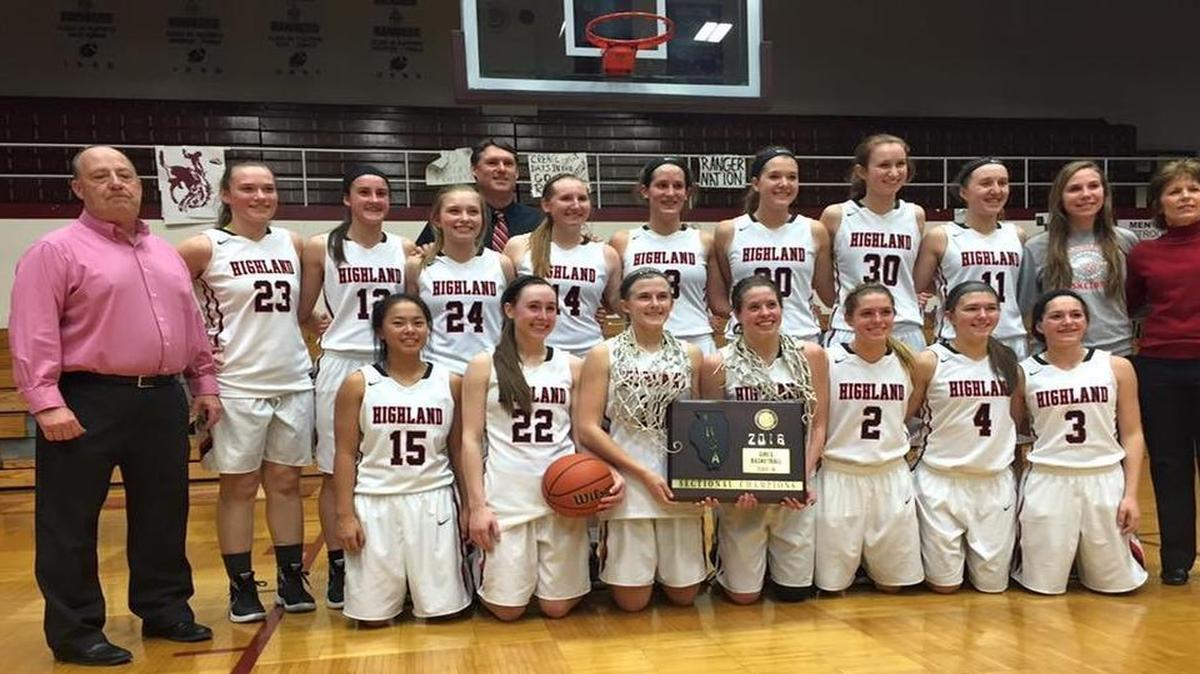 The Highland High School girls basketball team is all smiles while showing off the plaque after winning the Class 3A Benton Sectional with a 49-42 win over Civic Memorial Thursday at Benton High School. The Lady Bulldogs consist of, front row from left to right, Emmy Nyquist, Madison Wellen, Caitlin Lammers, Amanda Ponce, Rece Portell, Breanna Frahm, Katelyn Marti; back row, coach Mike Arbuthnot, Elizabeth Meadows, Kayla Eads, Alisse Koishor, assistant coach Chris Hartlieb, Lauren Baer, Alex LaPorta, Katie Kampwerth, Hayley Taylor, Mae Riffel, Abby Melosi and assistant coach Terri Menke.