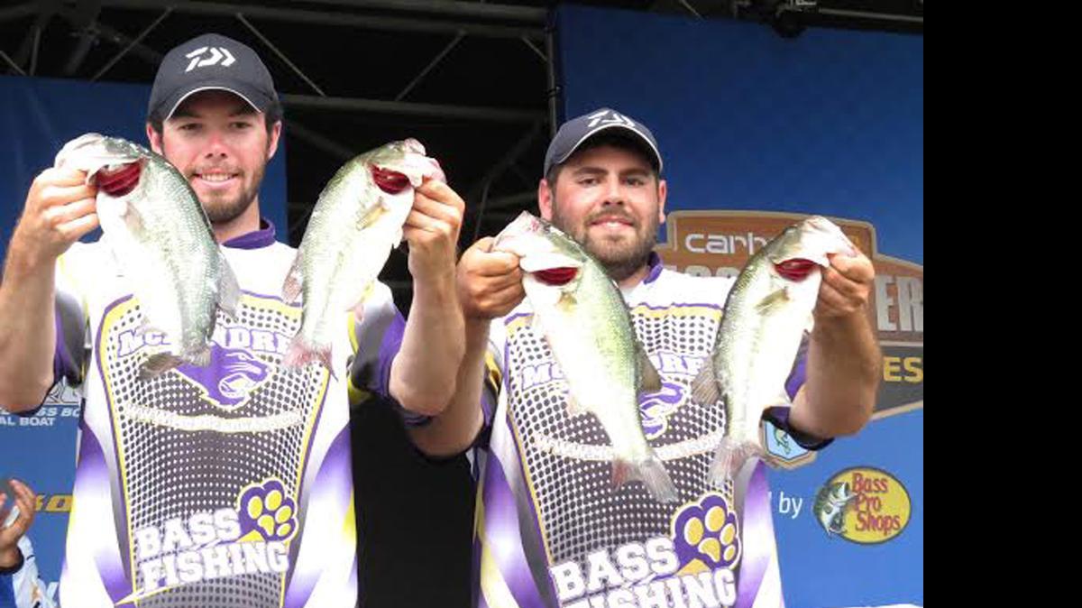 
McKendree University anglers Shane Campbell and Phillip Germagliotti, both of Highland, show off their fish that tipped the scales at 14 pounds, 7 ounces on day one on day one at Lake Barkley to qualify for the Bassmaster/Carhartt National Championship which will be held at Lake DuBay in Stevens Point, Wis. The duo from Highland then went out and caught fish weighing in at 13-10 on day two for a two-day total of 28-1, which was good for a second-place finish overall..
