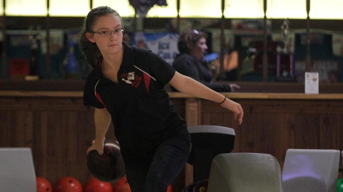 Highland sophomore Kayla Rutz shared high-game honors with a 243 second game to help the Lady Bulldogs defeat the host Triad Knights Tuesday, Dec. 12 at Camelot Bowl in Collinsville.