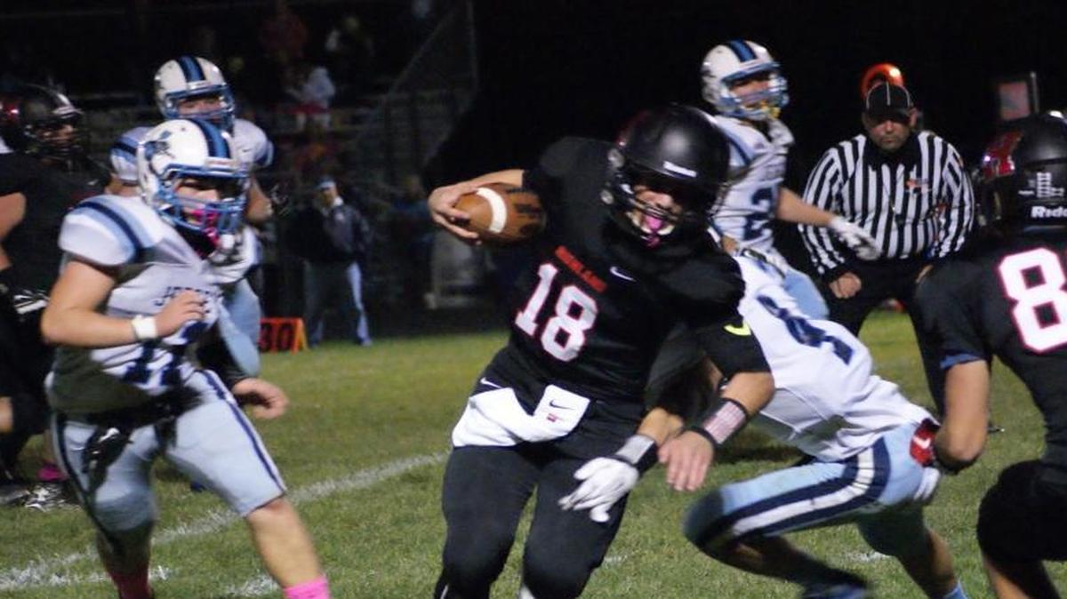 
Highland sophomore quarterback Garrett Marti breaks the tackle of Jerseyville defensive back Logan Metzler (4) and heads to the near sideline where he would cut it up field to cap off a 23-yard touchdown to put the Bulldogs on top 21-0 early in the second quarter of their 47-13 mauling of visiting Jerseyville Friday night.
