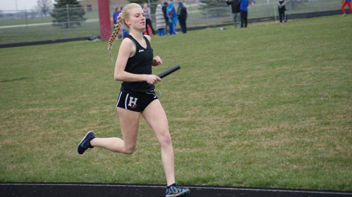 Highland sophomore Samantha Hengehold runs the opening leg of the meet-winning 4 x 800-meter relay team at a five-squad meet Wednesday, March 28 at Highland High School. Hengehold also won the 800 and finished second in the 1,600.