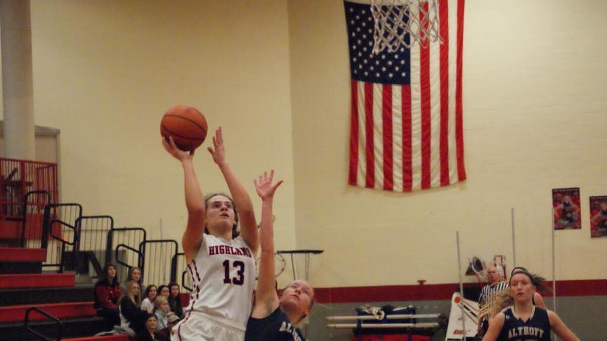 Highland freshman Bella LaPorta gets inside to score during the first half of the Lady Bulldogs’ 66-46 win over Althoff Saturday night in the first round of the 32nd Annual Highland Scott Credit Union Girls Basketball Tournament.