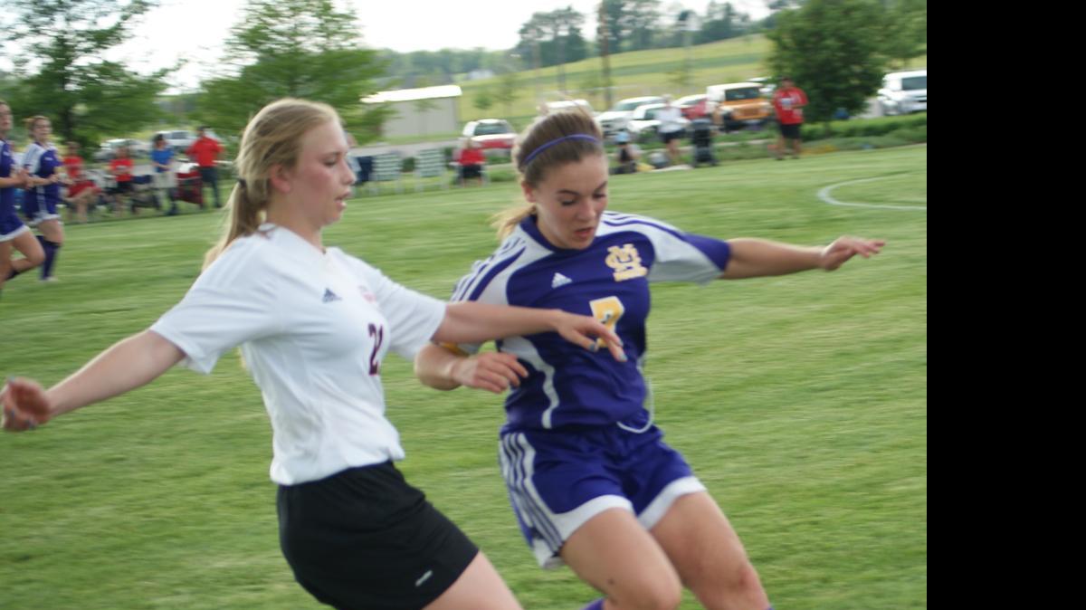 
Highland sophomore Alisse Koishor and Civic Memorial senior Summer Standefer challenge one another to make a play on the ball during the Lady Bulldogs’ 4-0 triumph over the Eagles on Tuesday of last week at Glik Park.
