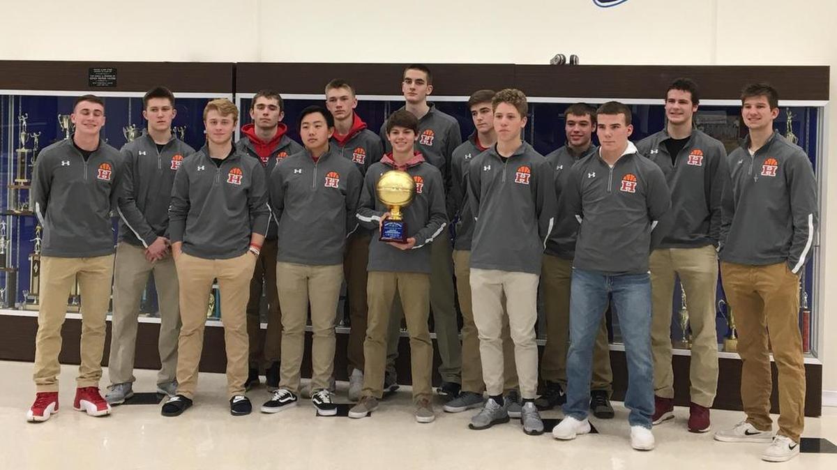 The Highland High School boys basketball team shows off its championship trophy after going 3-1 and winning the Jerseyville Mid-Winter Classic. The Bulldogs consist of, front row from left to right, Blake Barth, Cameron Altadonna, Michael Barth, Brylee Portell, Christian Kassey, Brady Feldmann, Stephen Schniers; back row, Jonathan Dickman, Mitchell Foult, Jake Kruse, Stephen Torre, Trent Lammers, Deakon Thornton and Sam LaPorta.