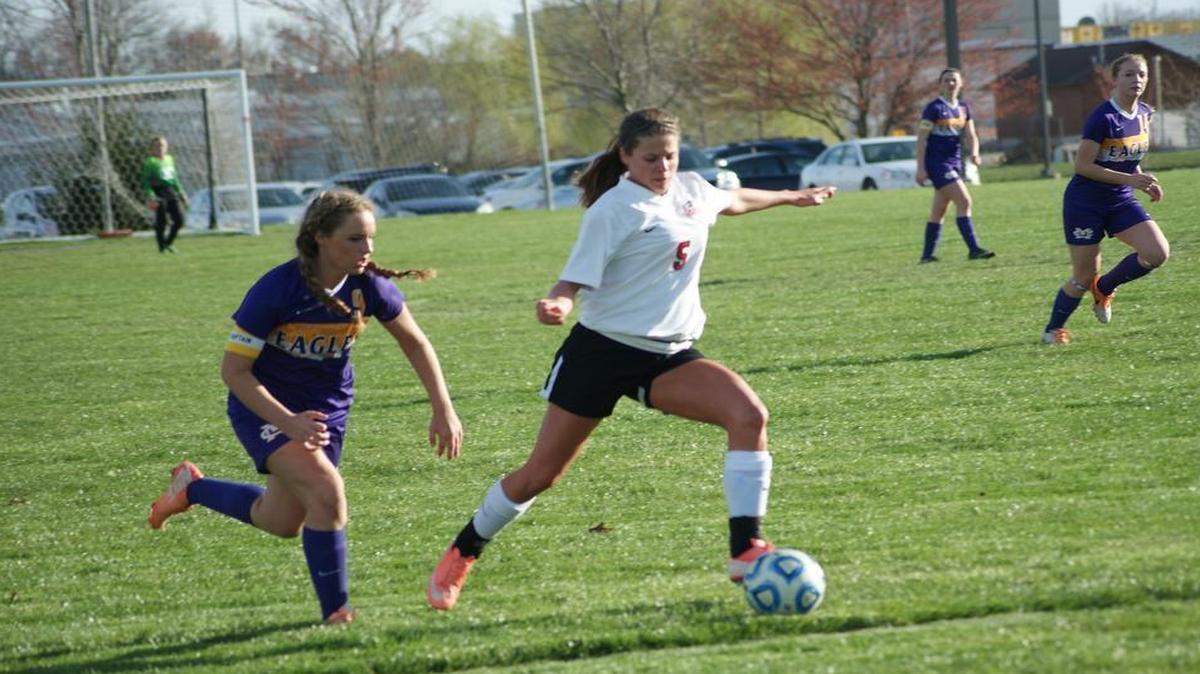 Highland senior forward Amanda Ponce gets set to blast the ball into Civic Memorial’s net to score the game-tying goal while being chased in vain by an Eagles defender during the second half of the two teams’ 2-2 tie Tuesday at Glik Park.