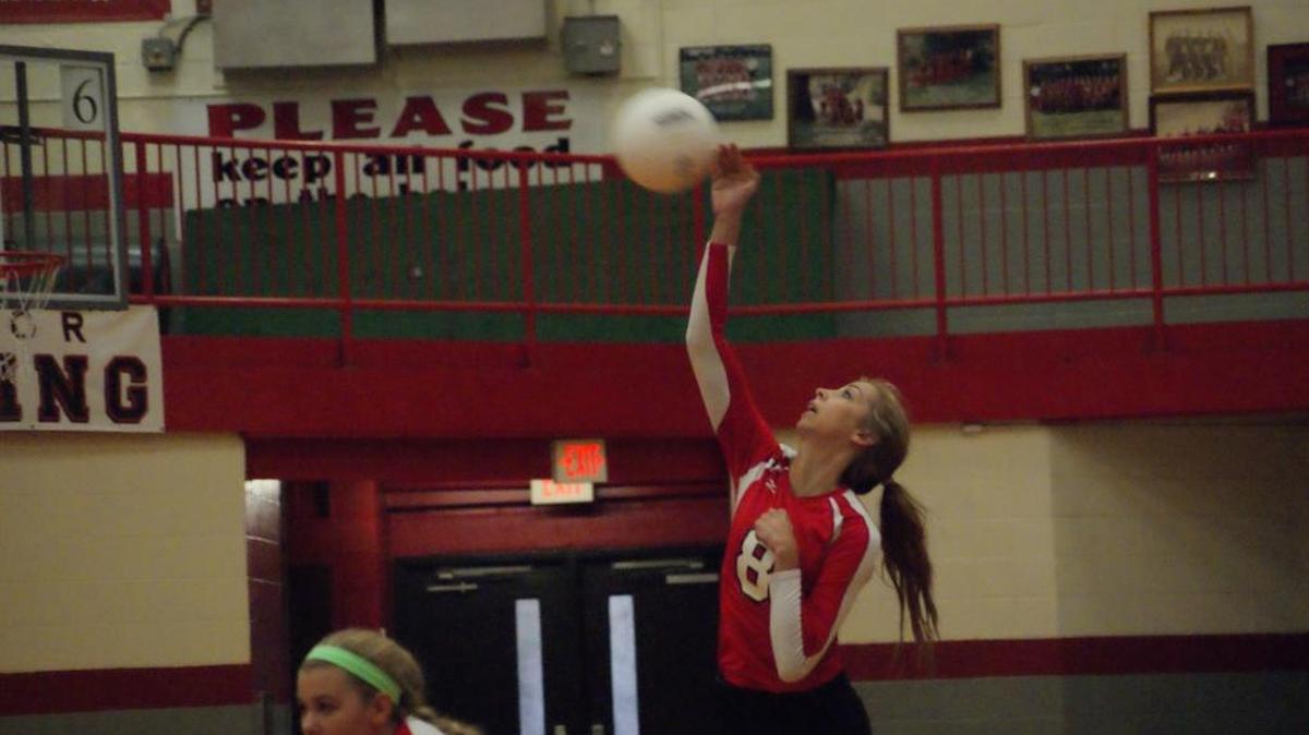 
Highland senior Alyssa Anderson serves up one of her seven aces during the Lady Bulldogs’ season-opening 25-16, 25-12 win over visiting Granite City Thursday night.
