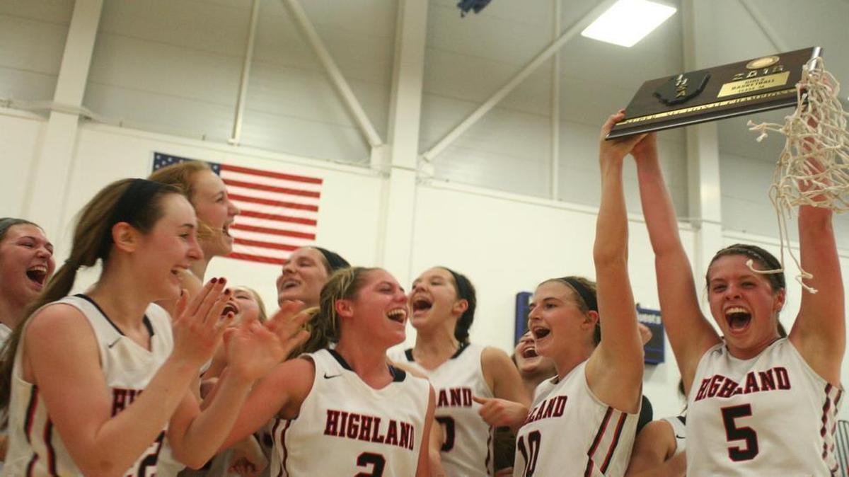 Highland seniors Amanda Ponce, right, and Caitlin Lammers lift the Springfield Super-Sectional plaque above their head as they celebrate with their teammates after HHS defeated Lincoln 48-40 on Monday at the University of Illinois Springfield.