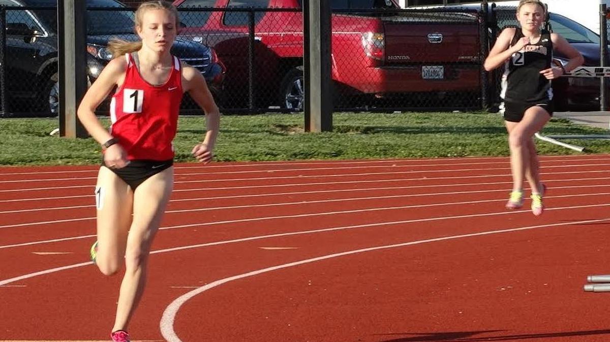 Highland senior Allison Zobrist pulls away from Waterloo’s Whitney Liefer en route to winning the 1,600 meters by 7.57 seconds with a winning four-lap time of 5:32.04 at the Mississippi Valley Conference Championships Thursday at Waterloo.