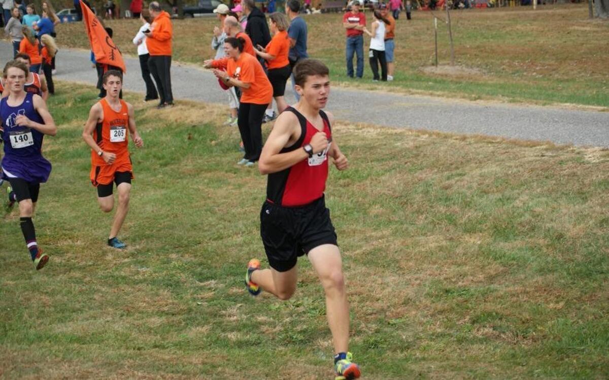 Highland junior Jacob Plocher competes en route to placing 16 th at the IHSA Class 2A Highland Regional held Saturday at Alhambra Township Park.