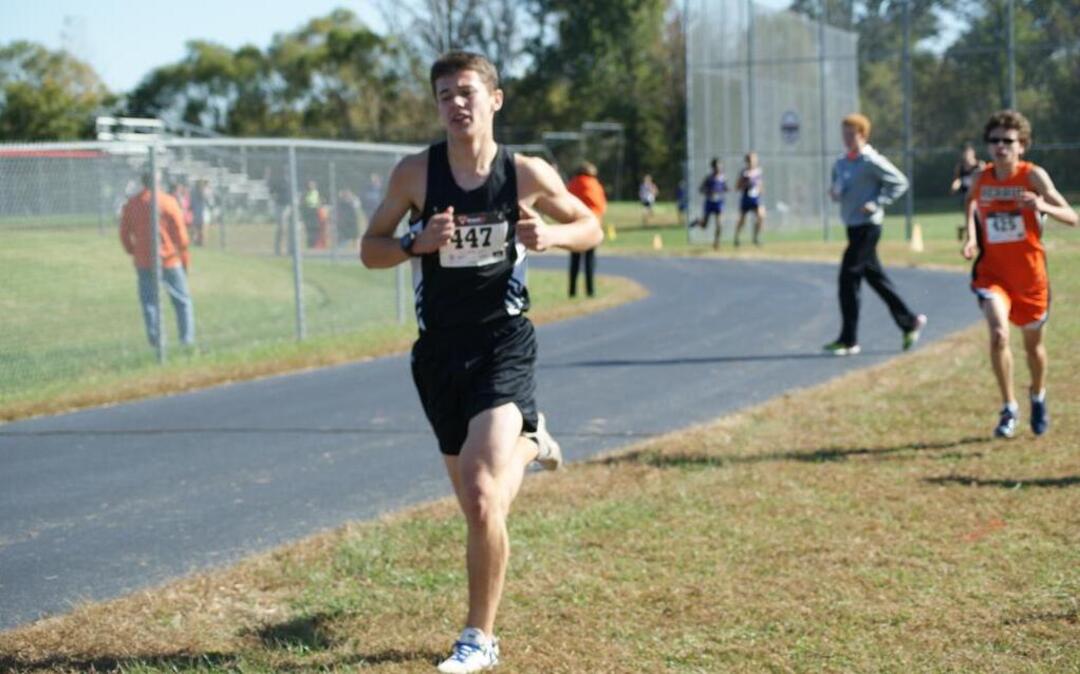 Highland senior Jacob Plocher runs near the end of the race at the Class 2A Triad Cross Country Regional Saturday at Triad High School, where he finished eighth out of 72 runners to qualify as an individual along with junior teammate Gabe Sherrill (25 th place) for this Saturday’s Decatur MacArthur Sectional.
