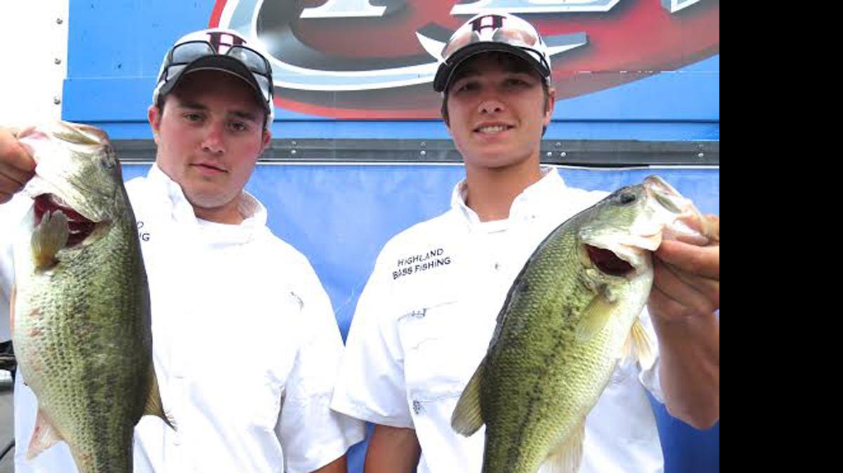 
Highland juniors Hampton Dufrain, left, and Blake Schumahcer show off their biggest bass on the second day that helped them climb into second place with a two-day total of 15 pounds, 6 ounces on Saturday of the IHSA Bass Fishing State Finals at Carlyle Lake. Dufrain’s bass was the biggest bass of the day and tipped the scales at 5-3.
