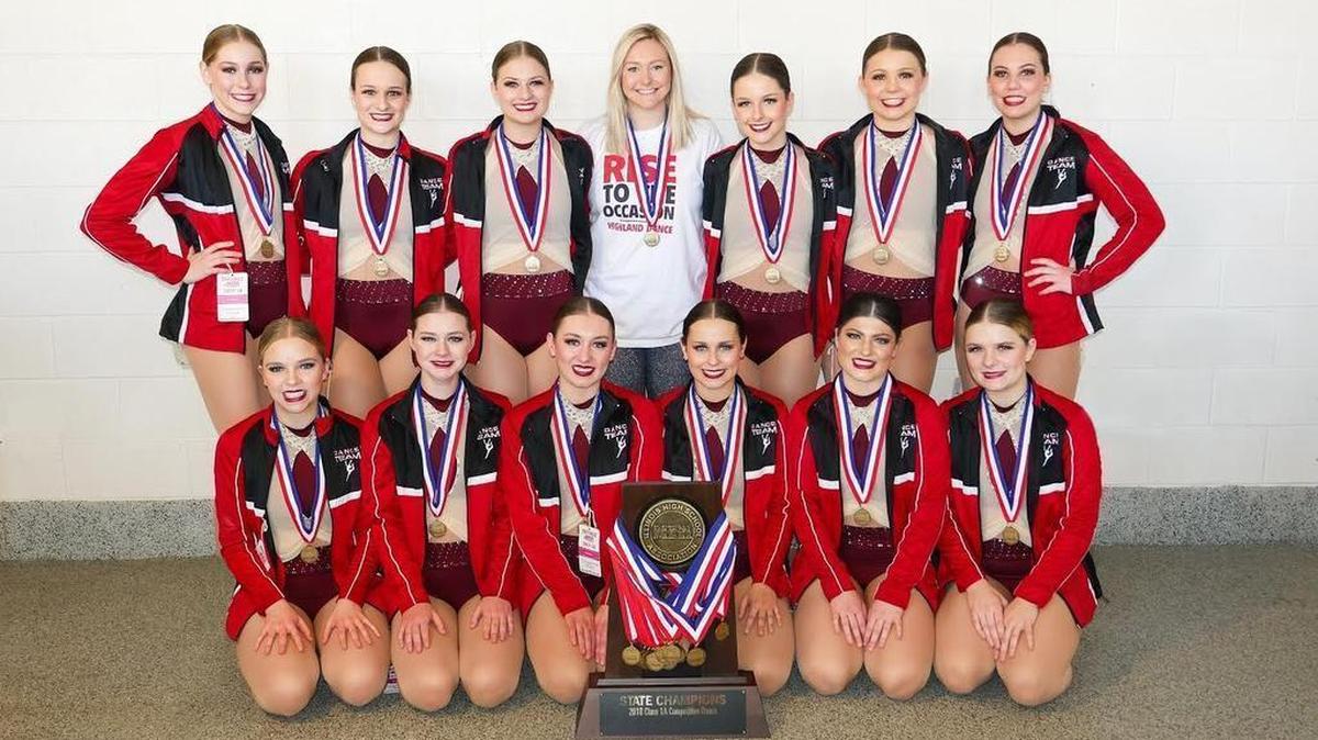 The Highland High School varsity dance team poses with the 1A state championship trophy it earned at the IHSA Competitive Dance State Finals on Saturday at Grossinger Motors Arena in Bloomington. The HHS varsity dance squad consists of, front row from left to right, Claire Pabst, Olivia Genteman, Abigail Rogier, Katie Etter, Kayla Davis, Paige Foster; back row, Abbey Mortland, Kylie McFarland, Brooke Wilson, Coach Emily Wellen, Bree Etherton, Alexis Finley and Tatum Stock.