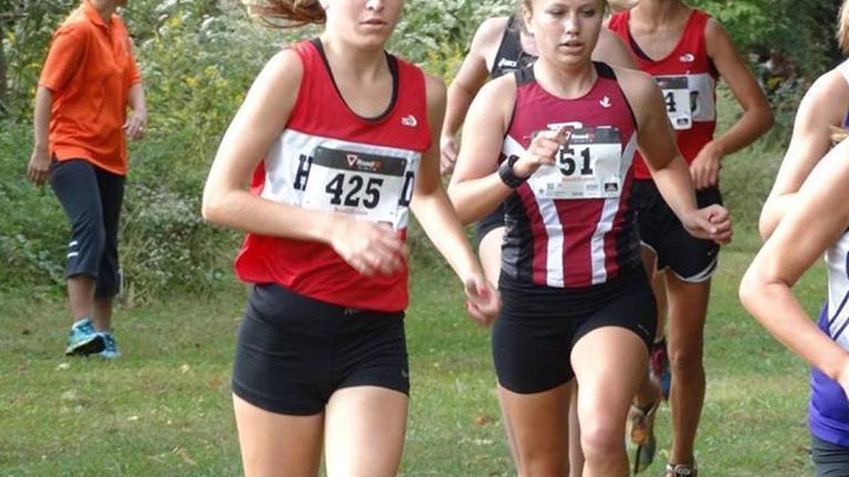 
Highland senior Allison Zobrist, left, competes in the Edwardsville Invitational on Saturday at the 3.1-mile course at SIUE. Zobrist finished in 33rd place out of 169 total competitors.
