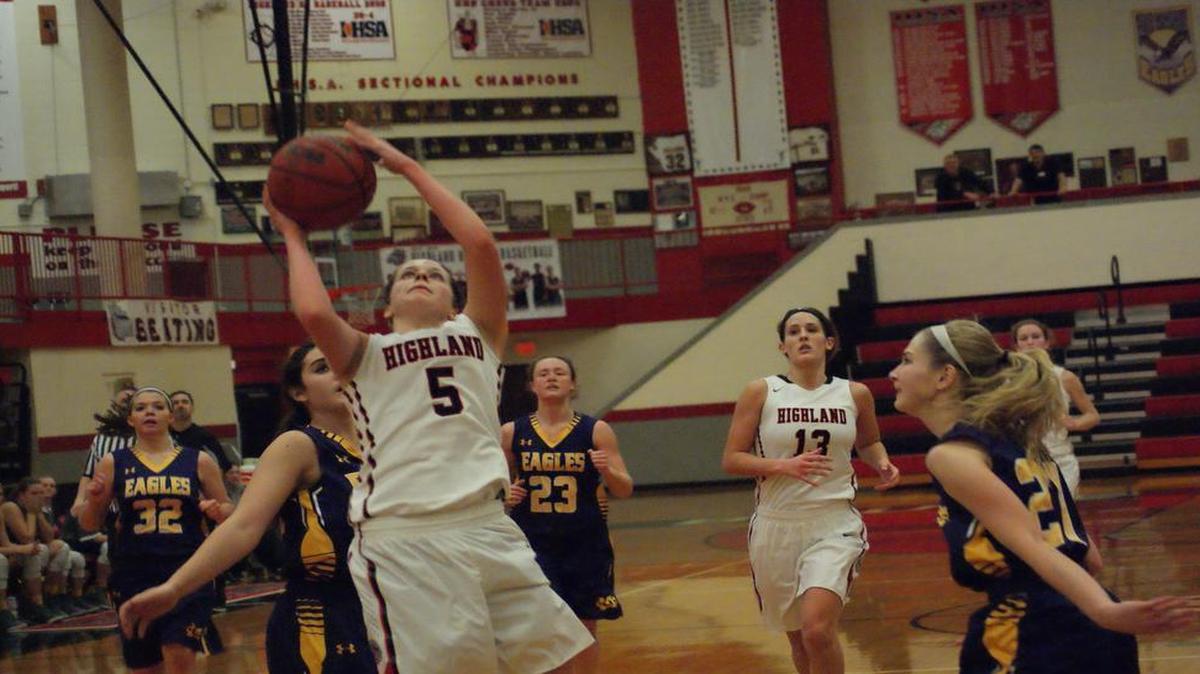 Highland senior Amanda Ponce beats a slew of Civic Memorial defenders down the court for a layup as junior teammate Alex LaPorta looks on during the fourth quarter of the Lady Bulldogs’ 45-42 victory over the Eagles Thursday night at HHS.