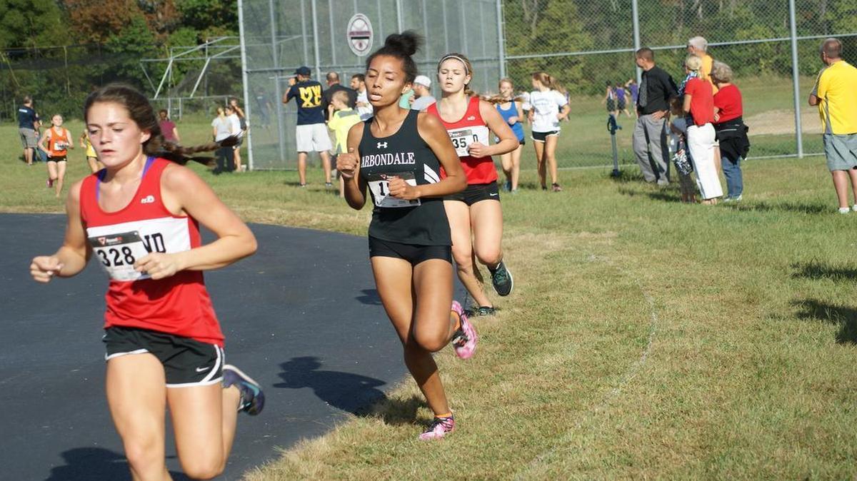
Highland sophomore Kate Marti leads Kaylia Fann of Carbondale and HHS junior teammate Sarah Beth Wiegman as the trio near the end of the Triad Invitational, held Wednesday at Triad High School.
