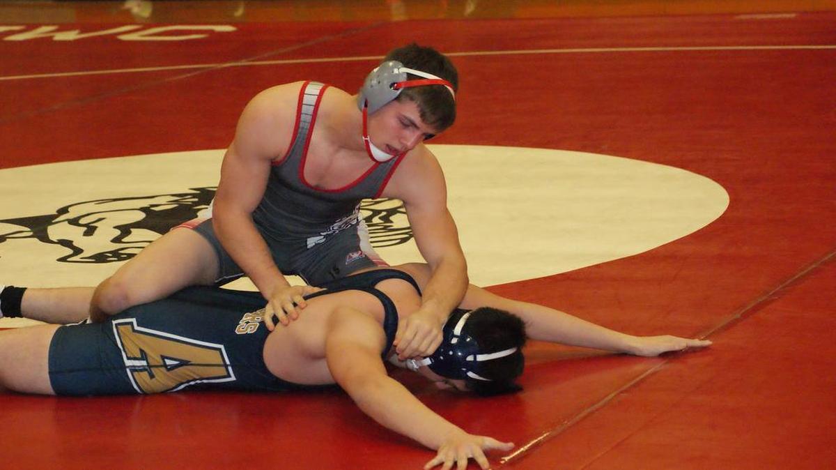 Highland junior Trent Rakers dominates Zach Guerrero of Althoff en route to pinning him in 53 seconds in their 160-pound match last Thursday night at a triangular match at HHS. Rakers went on to win the Murdale Wrestling Tournament, his fourth tournament championship in a row, over the weekend to remain undefeated at 22-0 on the season.