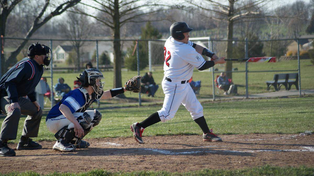Highland senior catcher Dylan Knebel connects for a single to left field to lead off a six-run second inning during the Bulldogs' 11-9 season-opening loss to visiting Freeburg Wednesday, March 21 at Glik Park.