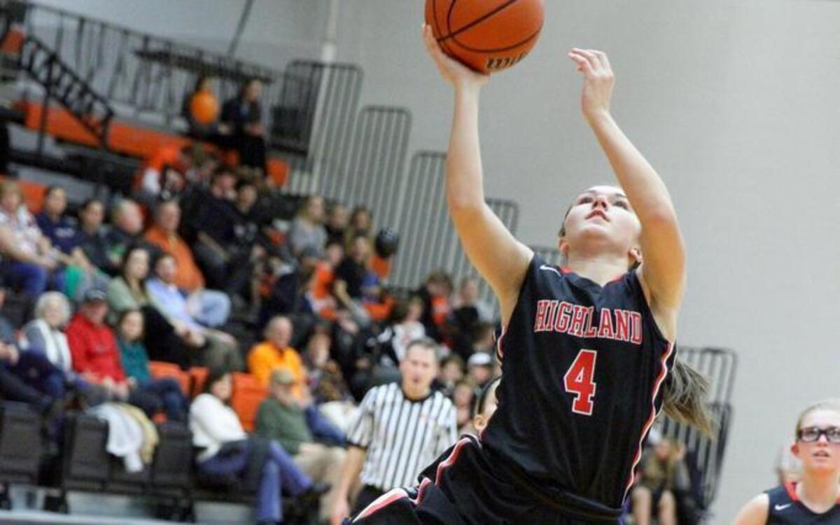 Highalnd senior guard Breanna Frahm goes in for a layup in transition ahead of the field during her team’s 80-47 rout of host Waterloo on Monday as fellow senior guard Alisse Koishor looks on form behind.