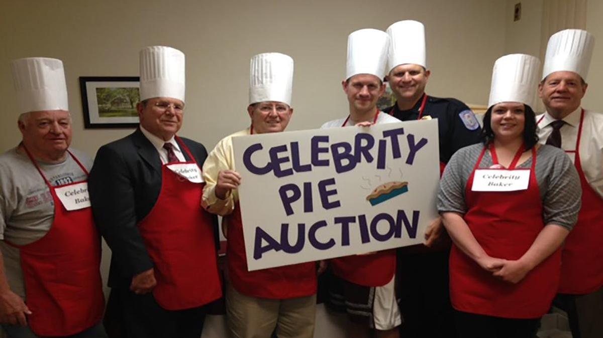 Participating in the Celebrity Pie Auction June 17 are, from left, City Councilman Neill Nicolaides, Jay Boulanger of Spengel-Boulanger Funeral Home, Mayor Joe Michaelis, Pastor Will VerDuin of Evangelical United Church of Christ, Chief of Police Terry Bell, Martha Edmonds of Highland Health Care, and Howard Held of Highland Chamber of Commerce. Also baking, but not present for the photo, are Curt Libbra of Highland News Leader, Carla Riva of Highland Health Care, and Mike Sutton, superintendent of Schools CUSD No. 5.
